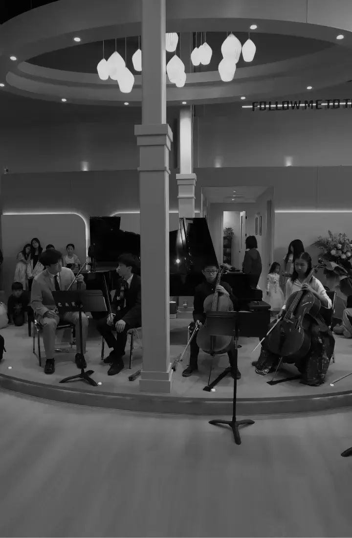 Students learning ensemble music in a structured music school environment at C&K Music